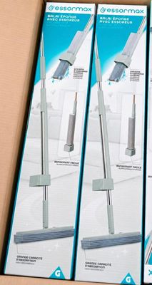 three boxes of vacuum cleaners sitting on top of a wooden table