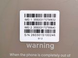 a warning sign on the back of a cell phone