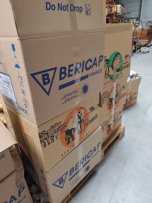 several boxes stacked on top of each other in a warehouse