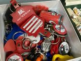 a box full of assorted key chains and other items