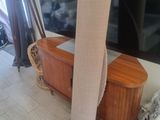 a tv that is sitting on top of a wooden table