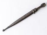 a close up of a knife on a white surface with a white background