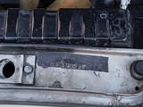 a close up of a car ' s engine with the hood open
