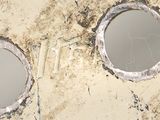 a close up of a piece of metal with holes in it