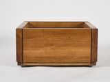 a small wooden box with a handle on a white background