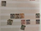 many different stamps on the wall in this room
