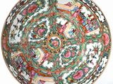 a bowl with a design on it on a white surface