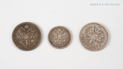 three different types of coins are shown on a white surface