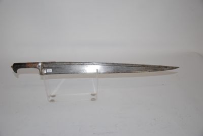 a knife that is sitting on a stand on a table