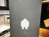 a picture of a piece of metal with a house sticker on it