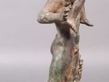 statue of a woman holding a child on her back