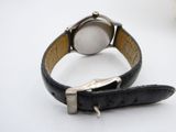 a watch that is sitting on a black leather strap