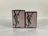 two boxes of yves saint laurent perfume on a white surface