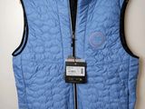 the vest is blue and has a badge on it