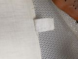 a close up of a piece of cloth on a chair