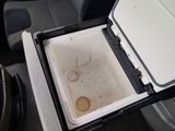 a cooler that is sitting in the back seat of a car