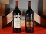 two bottles of wine sitting next to each other on a table