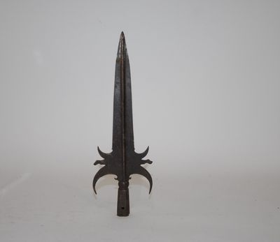 a close up of a knife on a white surface with a white background