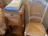 a chair that is next to a bed in a room