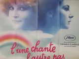 une affiche de film représentant le visage d'une femme avec un arc-en-ciel en arrière-plan