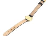a close up of a watch on a white surface with a white background