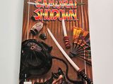 a book on the table with a knife and other items on it