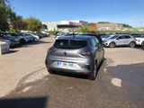 a silver car that is parked in a parking lot