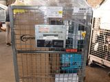 a large metal cage with a bunch of boxes in it
