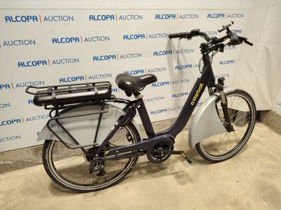 a bike that is parked in front of a wall