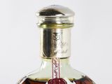a close up of a bottle of liquor on a table