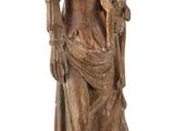 statue of a woman holding a bird and a bird on her arm