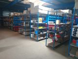 a large room with a lot of shelvings and shelves