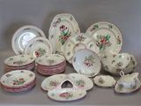 many plates and bowls that are sitting on a table