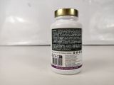 a close up of a bottle of vitamin supplements on a table