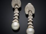 a pair of pearl and diamond earrings