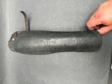 a person holding a piece of metal in their hand