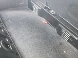 a gun in the back seat of a car