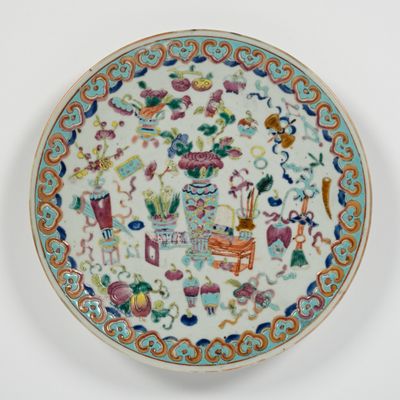 a plate that has a picture of a garden on it