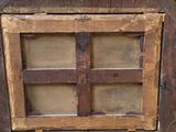an old wooden window with a cross on it