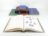 several books are stacked on top of each other on a table
