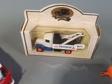 two toy cars that are sitting next to each other