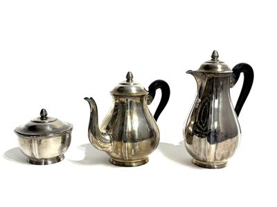 three silver teapots and a silver teapot on a white surface