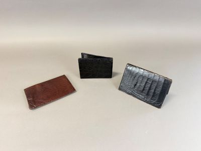 three different types of wallets on a white surface