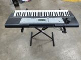 a keyboard that is sitting on a stand in a room