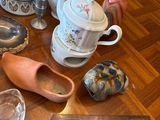 many different types of pottery on the table