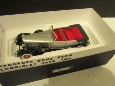 a model of a car in a box on a table