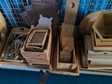 many wooden boxes with various items in them on a shelf