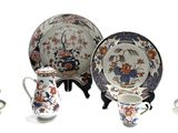 a group of plates and cups on a table