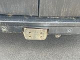 a close up of the bumper of a car with rust on it