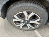 a close up of a tire on the side of a car